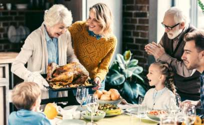 a family enjoying a turkey dinner