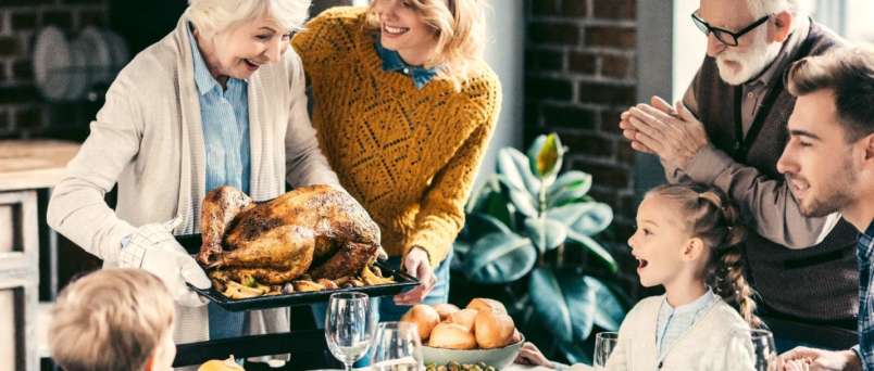 a family enjoying a turkey dinner