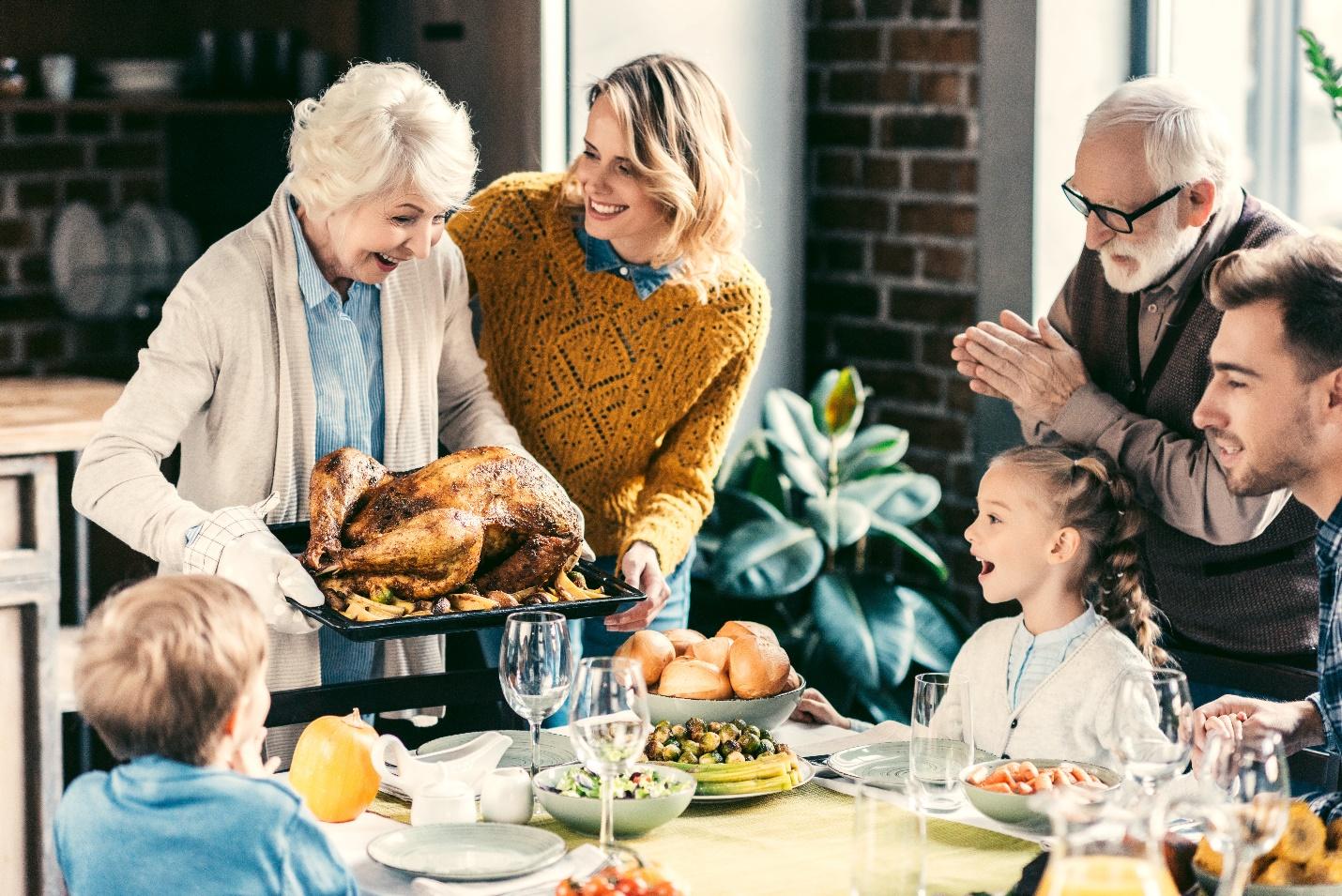 a family enjoying a turkey dinner