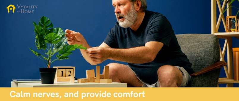senior man with plant and blocks for sensory therapy for alzheimers