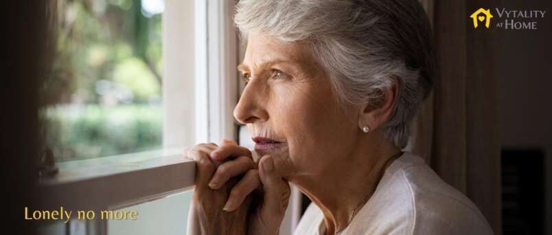 lonely senior looking out window