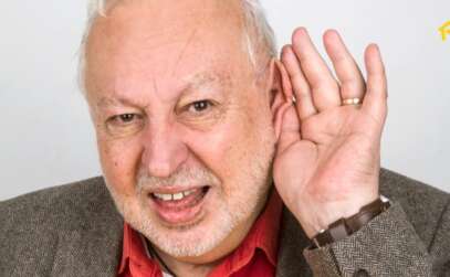 Senior man with hand to ear for hearing loss